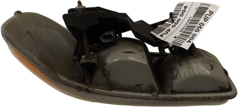 15218077 1999-2006 GMC Sierra 1500 Driver FL Headlight Used OEM 16524541